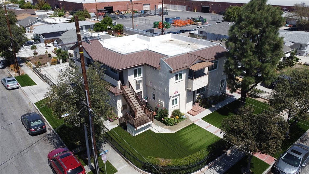 an aerial view of a house with garden space barbeque and lake view