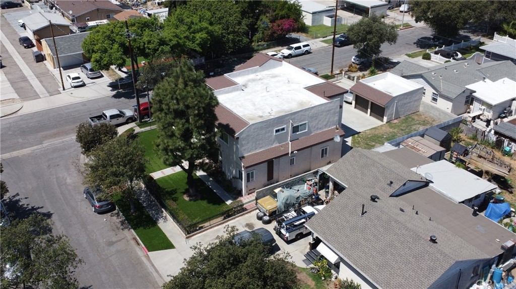 3419 Gregory Avenue Fullerton, CA 92833 - Photo 3 of 8 an aerial view of a residential apartment building with a yard and parking spaces