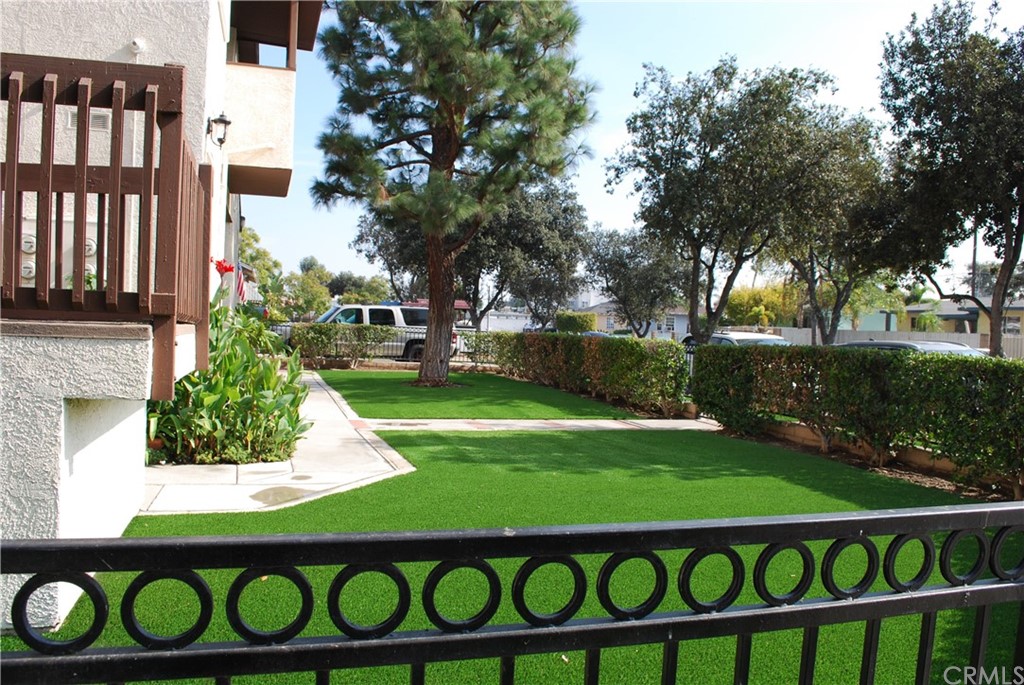 3419 Gregory Avenue Fullerton, CA 92833 - Photo 6 of 8 a view of a wooden bench in a garden
