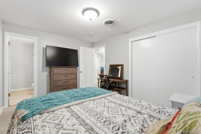 a bathroom with a sink a toilet and vanity