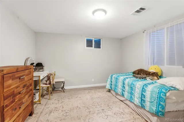 a bedroom with a bed and furniture