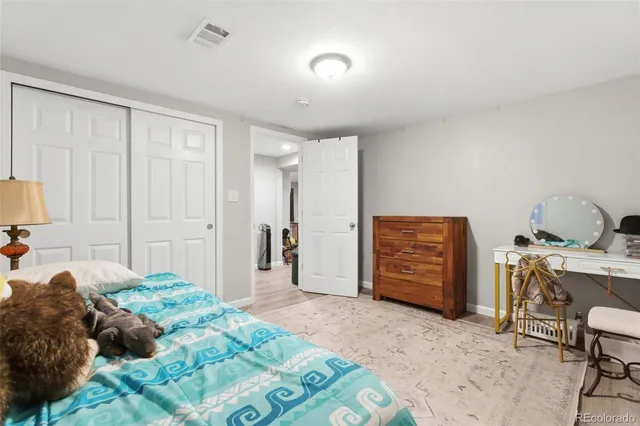 a bathroom with a sink toilet a mirror and shower