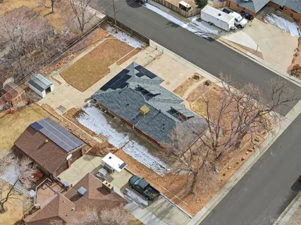 a view of a yard with snow on the road