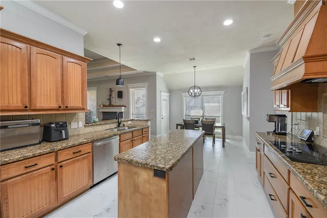 a large kitchen with granite countertop lots of counter top space