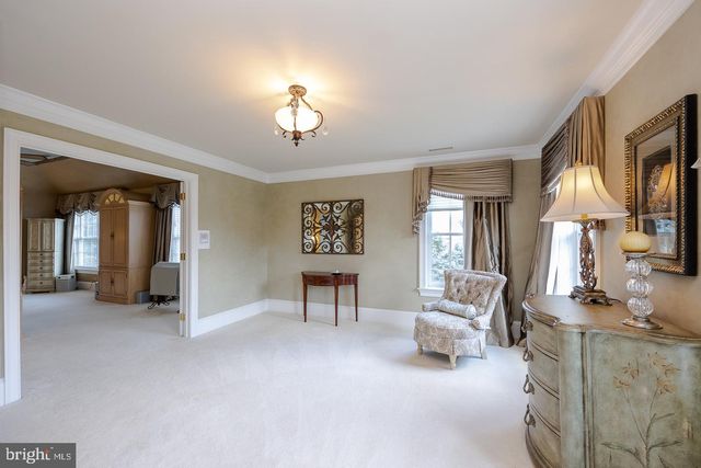 a view of a livingroom with furniture and a window