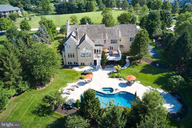 an aerial view of a house with yard swimming pool and outdoor seating