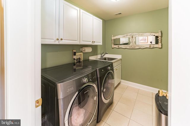 a view of a swimming pool with an outdoor space and seating area