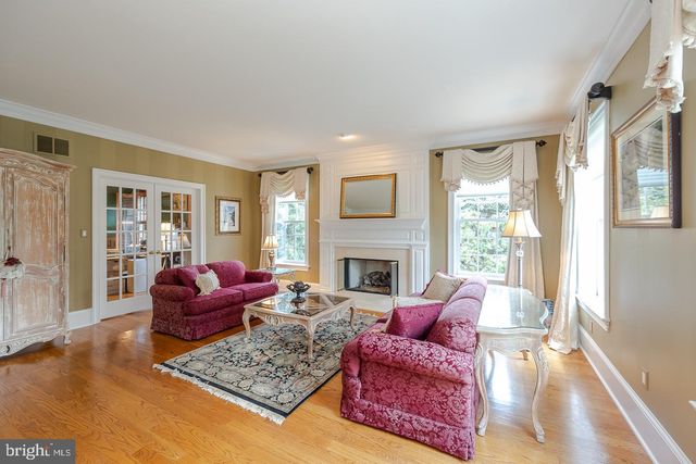a living room with furniture rug and window
