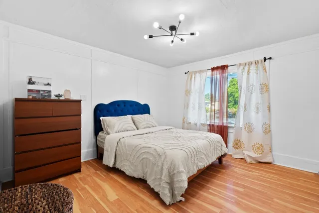 a bedroom with a bed and a dresser