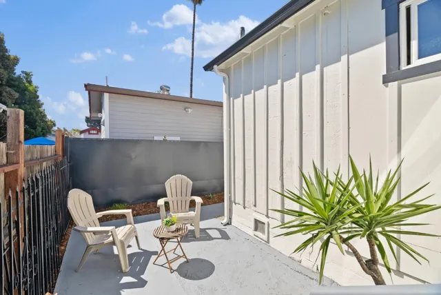 a view of a chairs and table in the patio