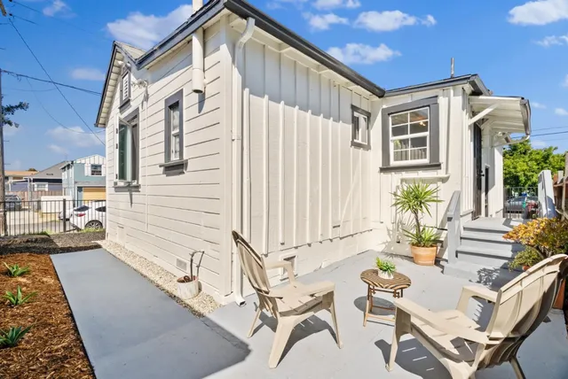 a view of a balcony with furniture