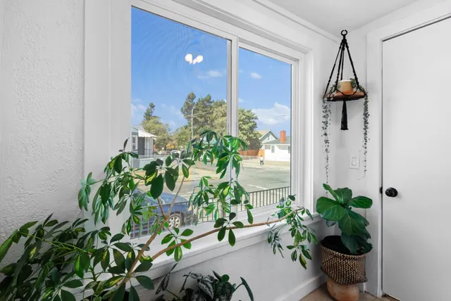 a vase of flowers sitting on a floor