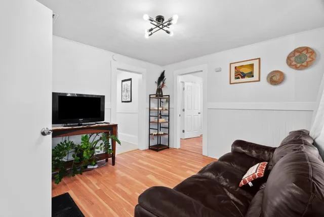 a bedroom with a bed and a television