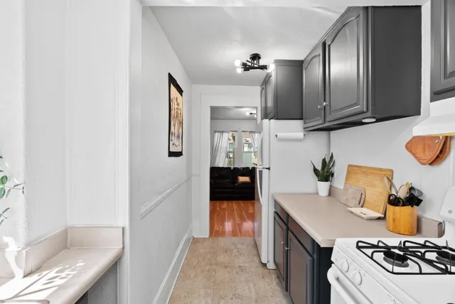 a view of a kitchen cabinets and a stove