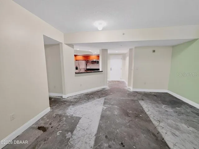 a view of a livingroom with wooden floor and flat screen tv