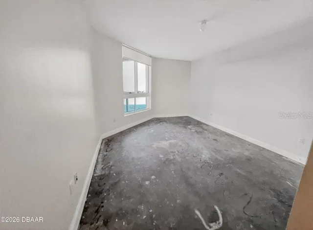 a view of an empty room and window