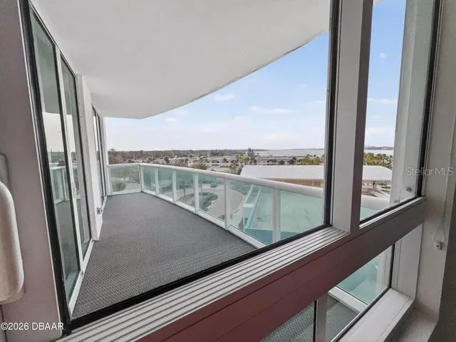 a view of a balcony with city view