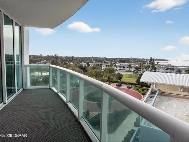a view of a balcony with city view