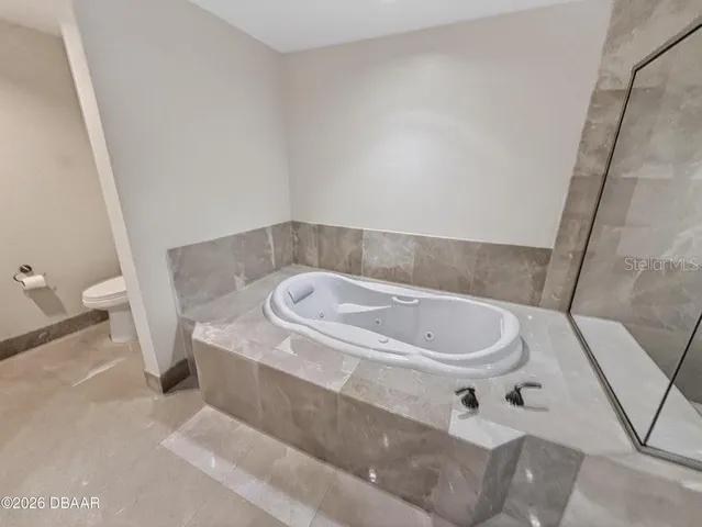 a bathroom with a sink and toilet