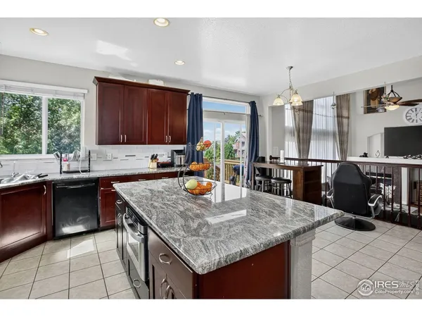 a kitchen with a counter top space appliances and a center island
