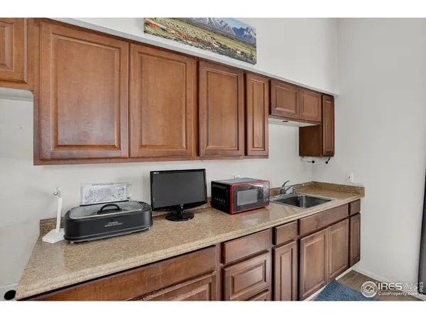a kitchen with stainless steel appliances granite countertop a sink stove and microwave