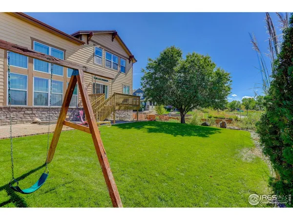 a view of a big yard in front of a house