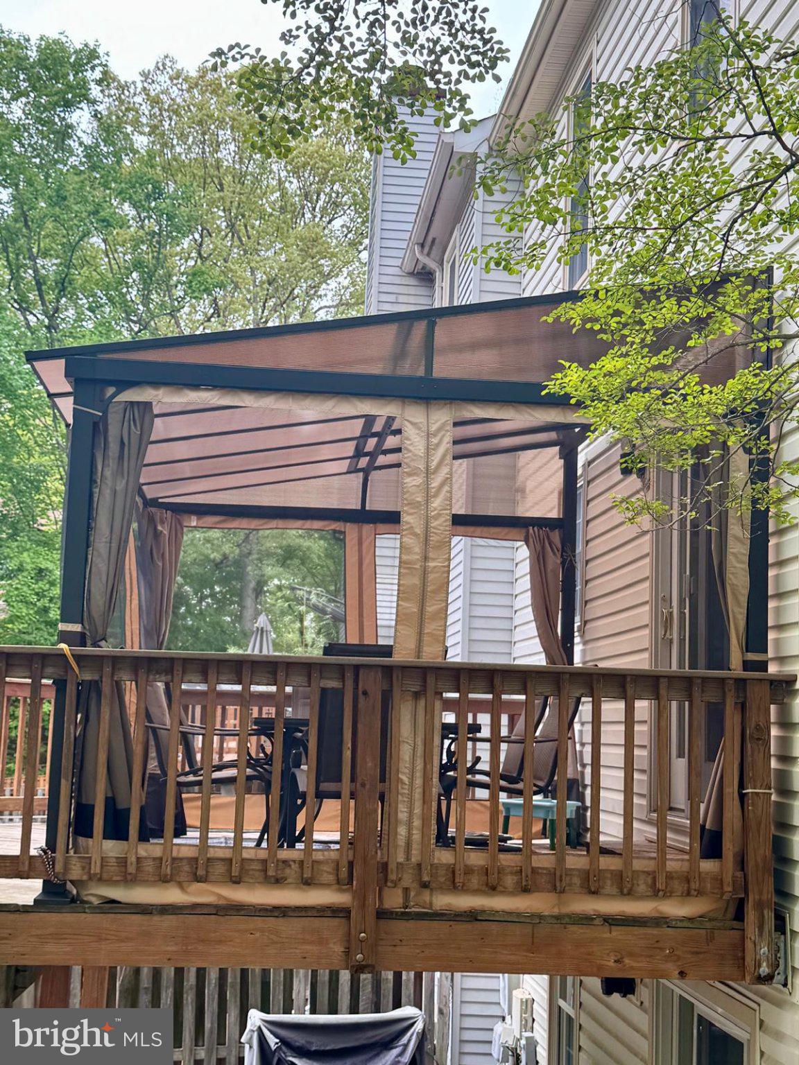 7408 Spring Tree Drive Springfield, VA 22153 - Photo 2 of 3 Charming deck with a cozy canopy.