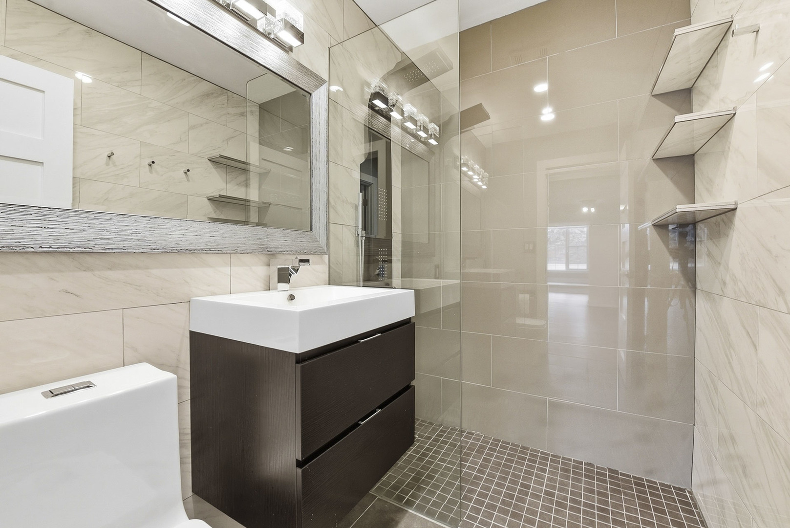 7303 West 75th Street Bridgeview, IL 60455 - Photo 20 of 48 a bathroom with a sink toilet and shower
