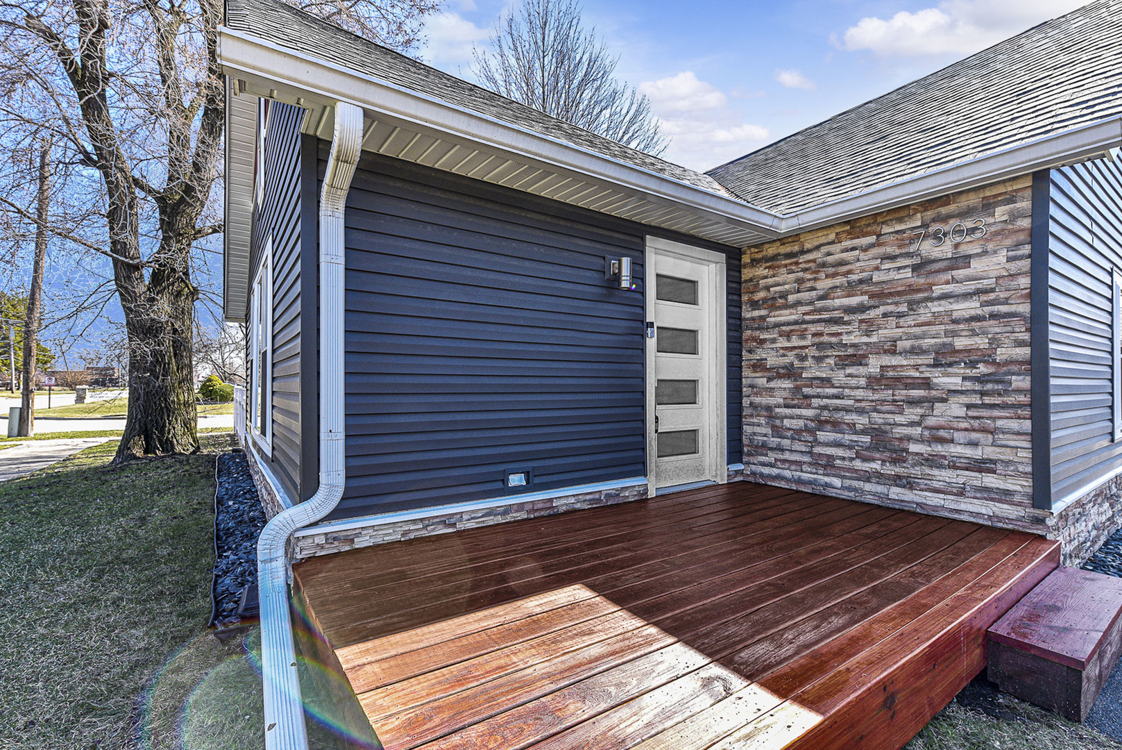 7303 West 75th Street Bridgeview, IL 60455 - Photo 2 of 48 a view of wooden door with a bench
