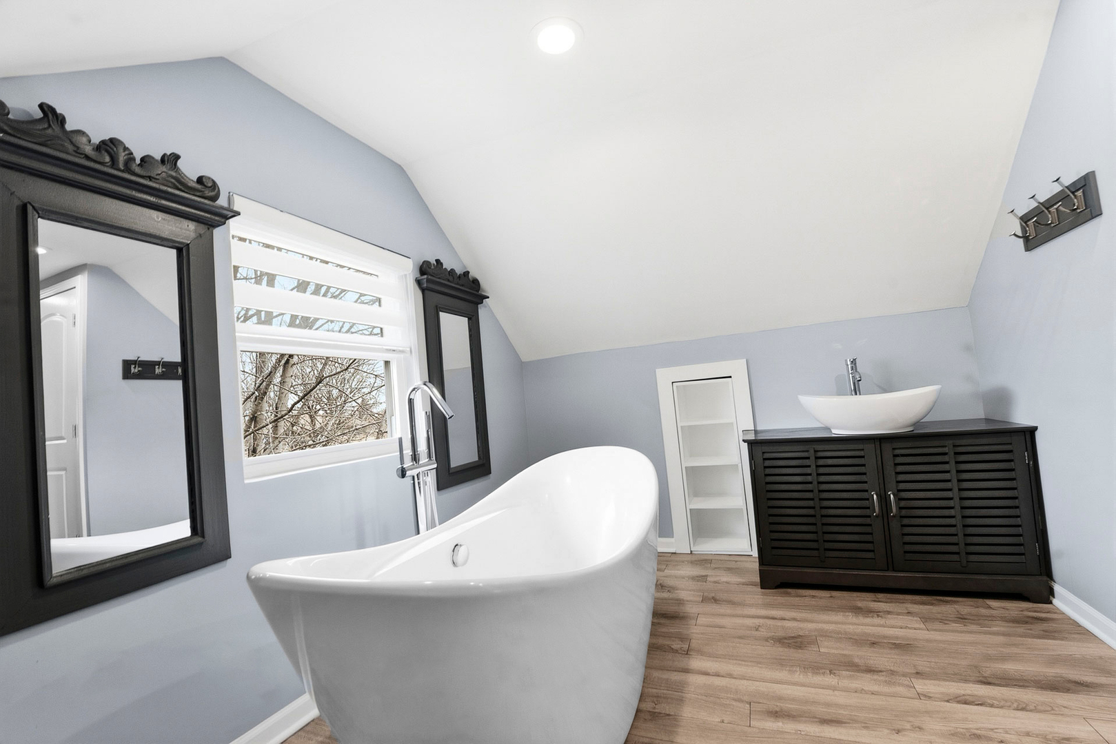 7303 West 75th Street Bridgeview, IL 60455 - Photo 28 of 48 a bathroom with a sink and mirror