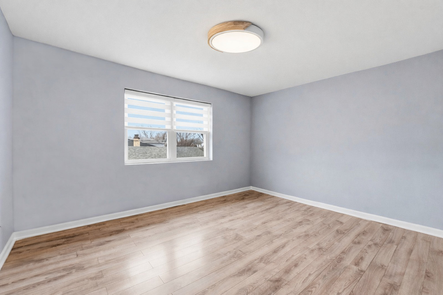 7303 West 75th Street Bridgeview, IL 60455 - Photo 33 of 48 wooden floor in an empty room with a window