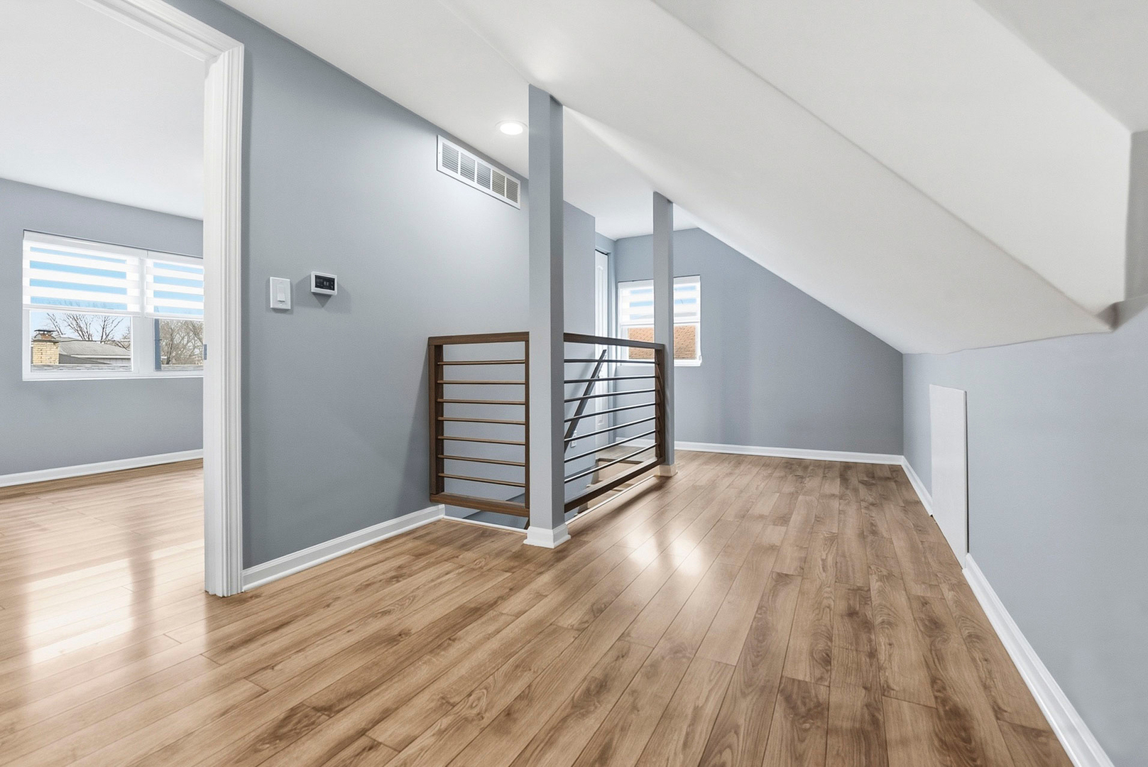 7303 West 75th Street Bridgeview, IL 60455 - Photo 36 of 48 a view of an empty room with wooden floor and stairs