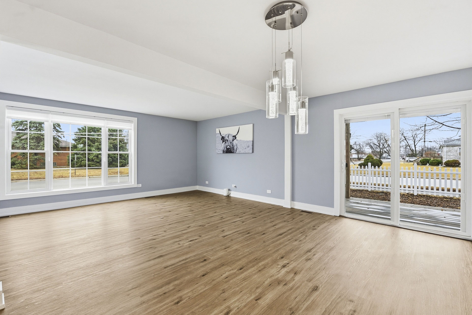 7303 West 75th Street Bridgeview, IL 60455 - Photo 8 of 48 a view of empty room with wooden floor and fan