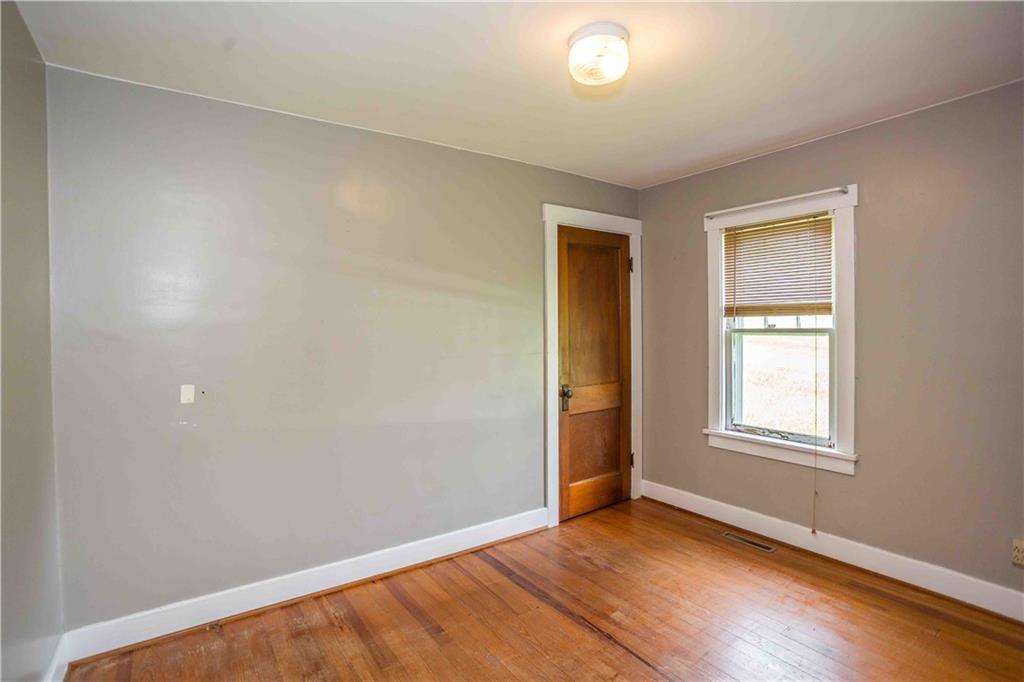 50 Ellenberger Road Indiana, PA 15701 - Photo 16 of 34 an empty room with wooden floor and windows
