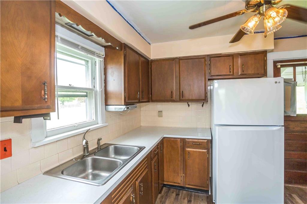50 Ellenberger Road Indiana, PA 15701 - Photo 19 of 34 a kitchen with a refrigerator a sink and cabinets