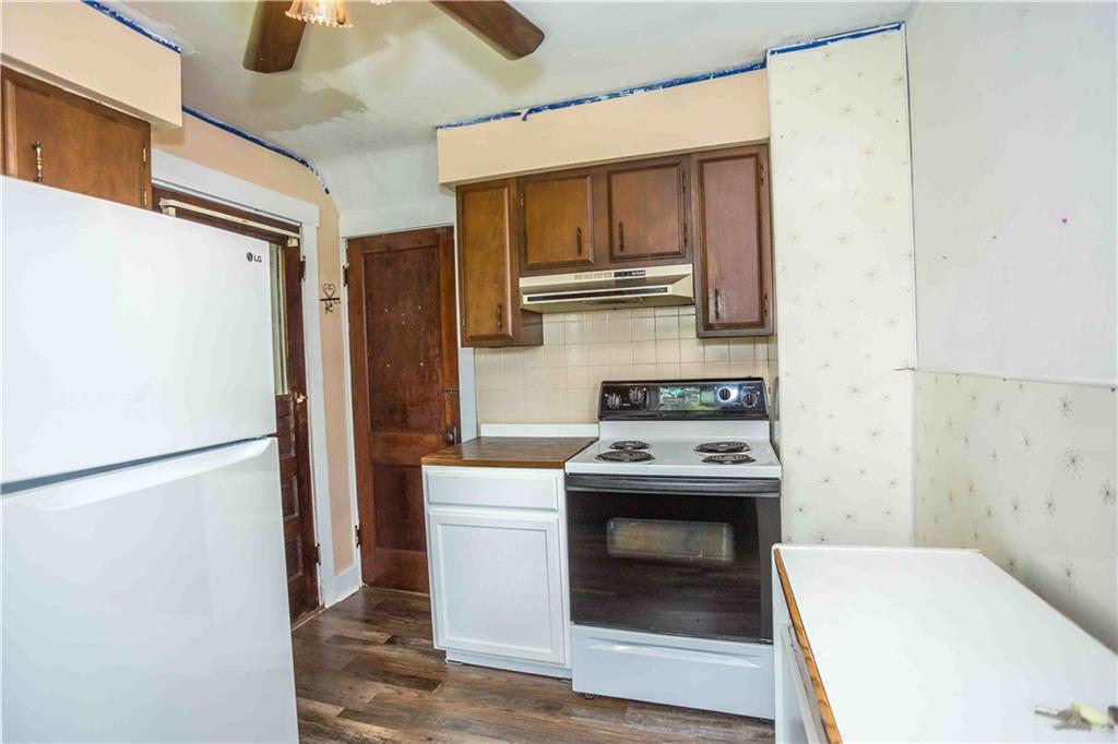 50 Ellenberger Road Indiana, PA 15701 - Photo 20 of 34 a kitchen with a stove and a refrigerator