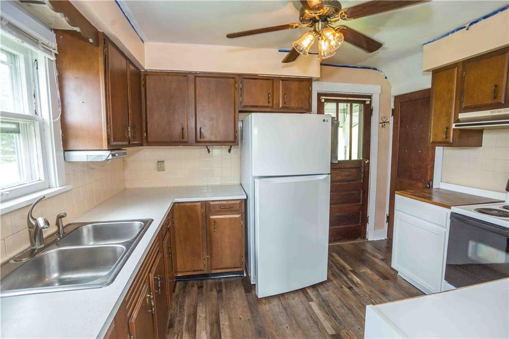 50 Ellenberger Road Indiana, PA 15701 - Photo 24 of 34 a kitchen with cabinets a refrigerator and a sink
