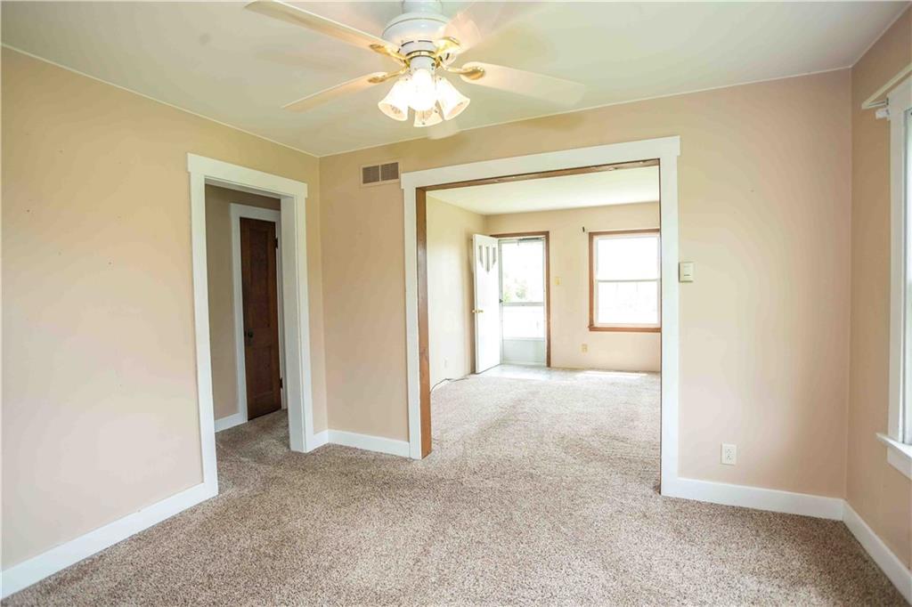 50 Ellenberger Road Indiana, PA 15701 - Photo 9 of 34 an empty room with a ceiling fan and a window