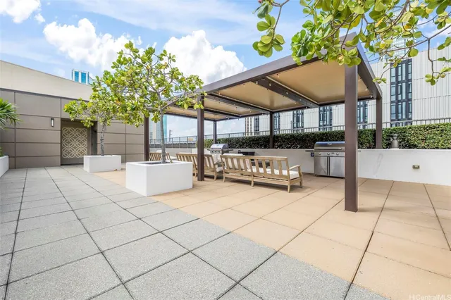 a view of a patio with table and chairs and potted plants