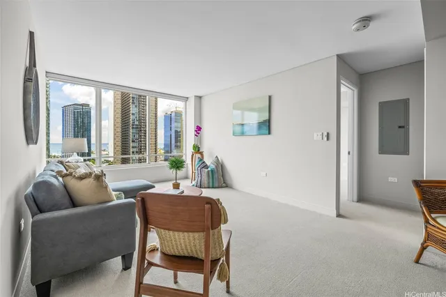 a living room with furniture and a large window