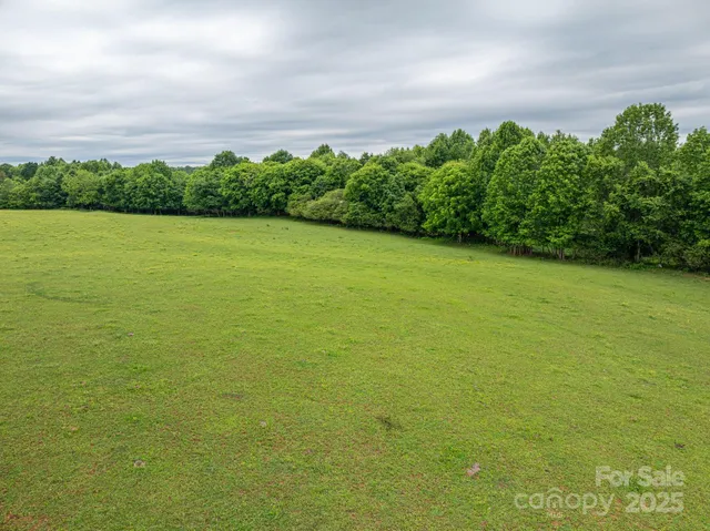 a view of a field with an outdoor space
