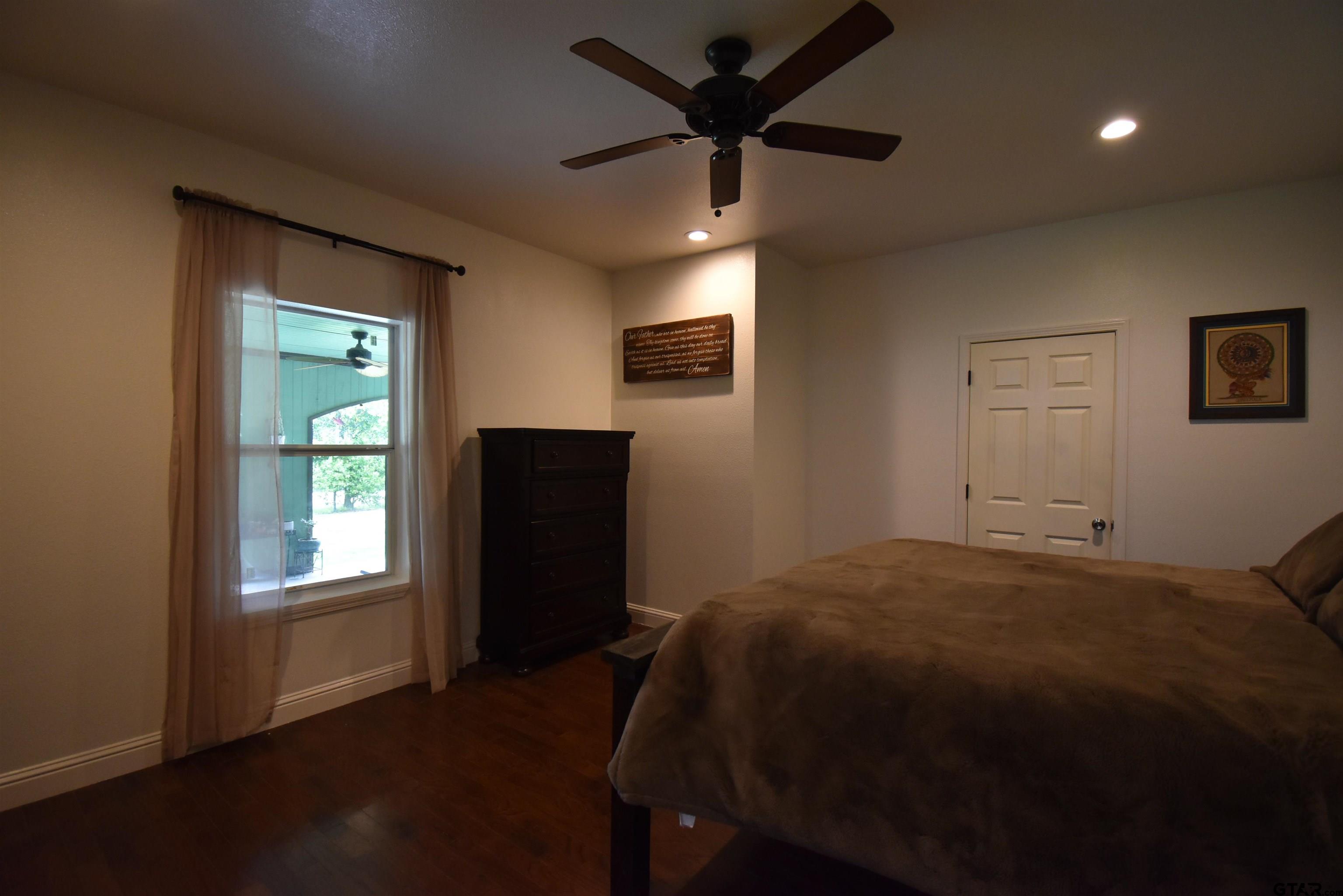 7727 Knowles Trace Tyler, TX 75708 - Photo 20 of 34 a bed room with a bed and a window