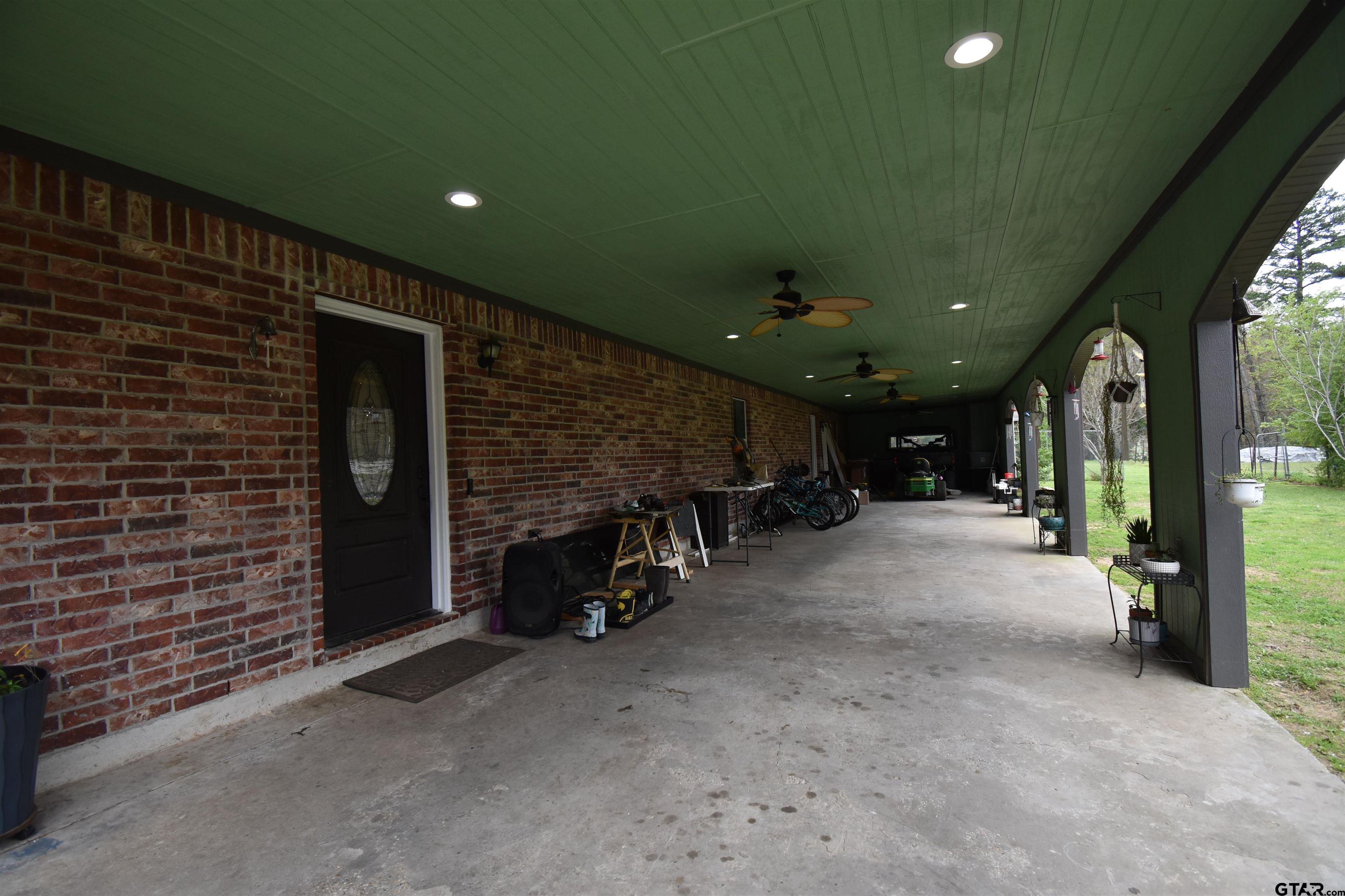 7727 Knowles Trace Tyler, TX 75708 - Photo 2 of 34 a view of the porch of a house