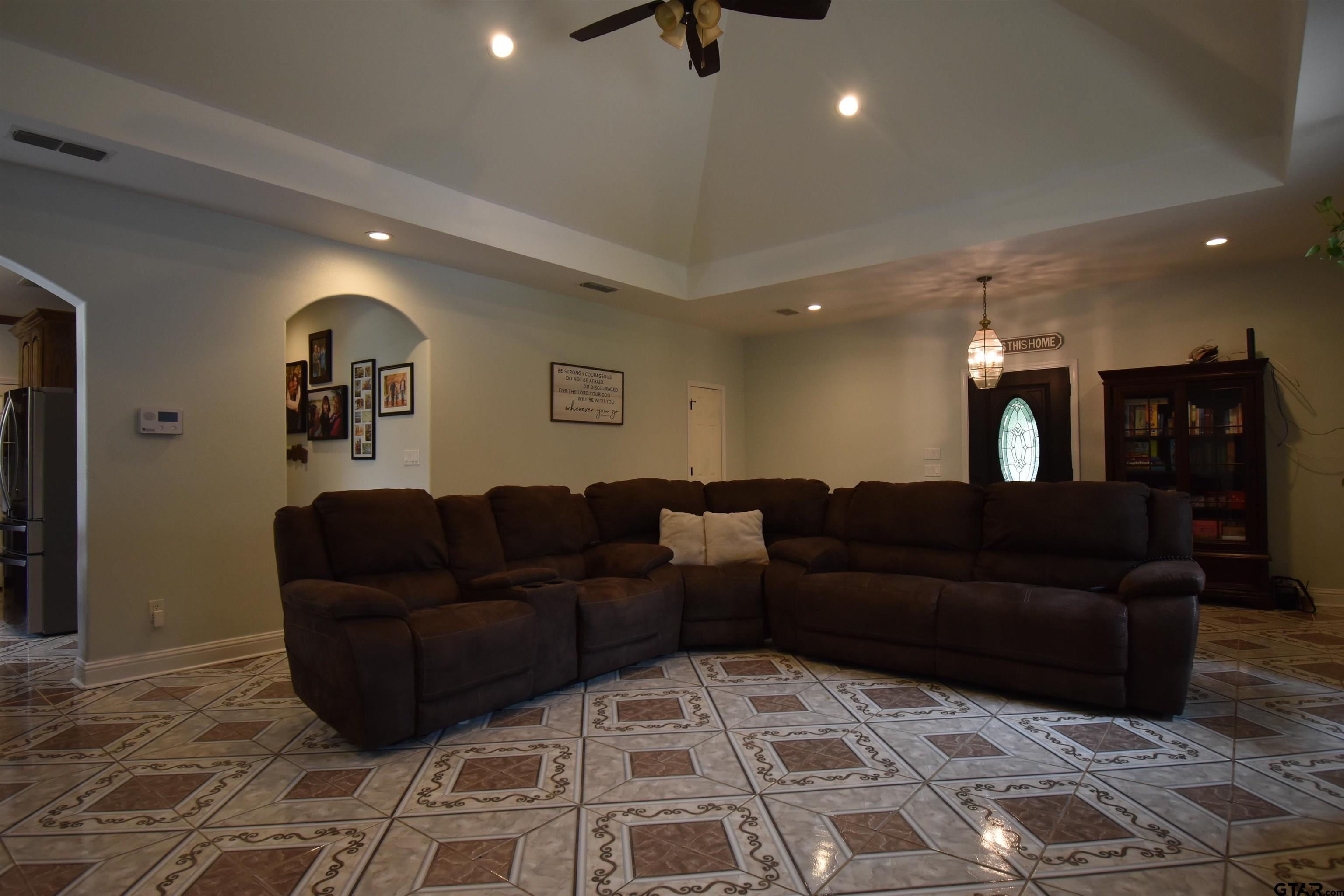 7727 Knowles Trace Tyler, TX 75708 - Photo 9 of 34 a living room with furniture and a wooden floor