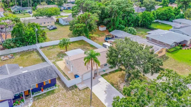 an aerial view of a house with a swimming pool
