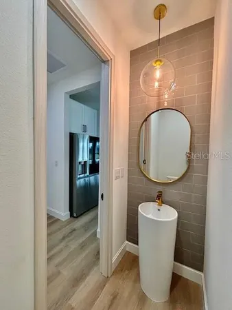 a bathroom with a sink and mirror