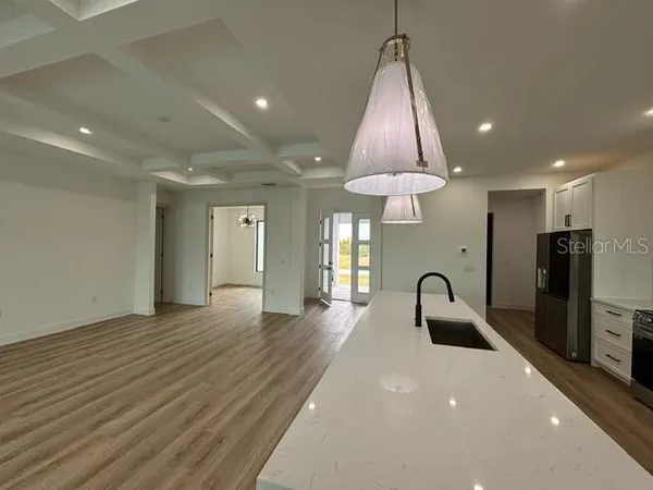 a kitchen with stainless steel appliances a refrigerator and a sink