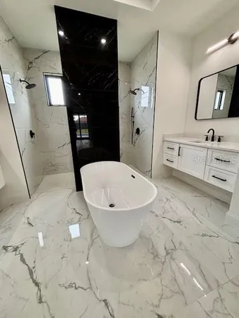 a bathroom with a sink and mirror