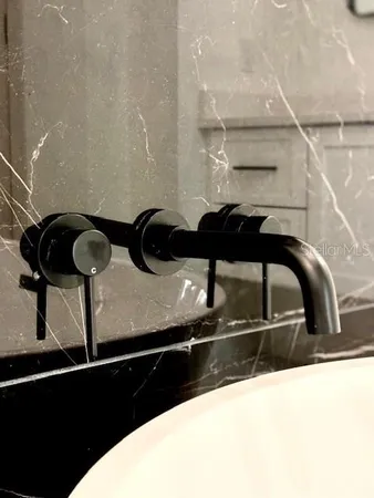 a kitchen with a sink and a refrigerator