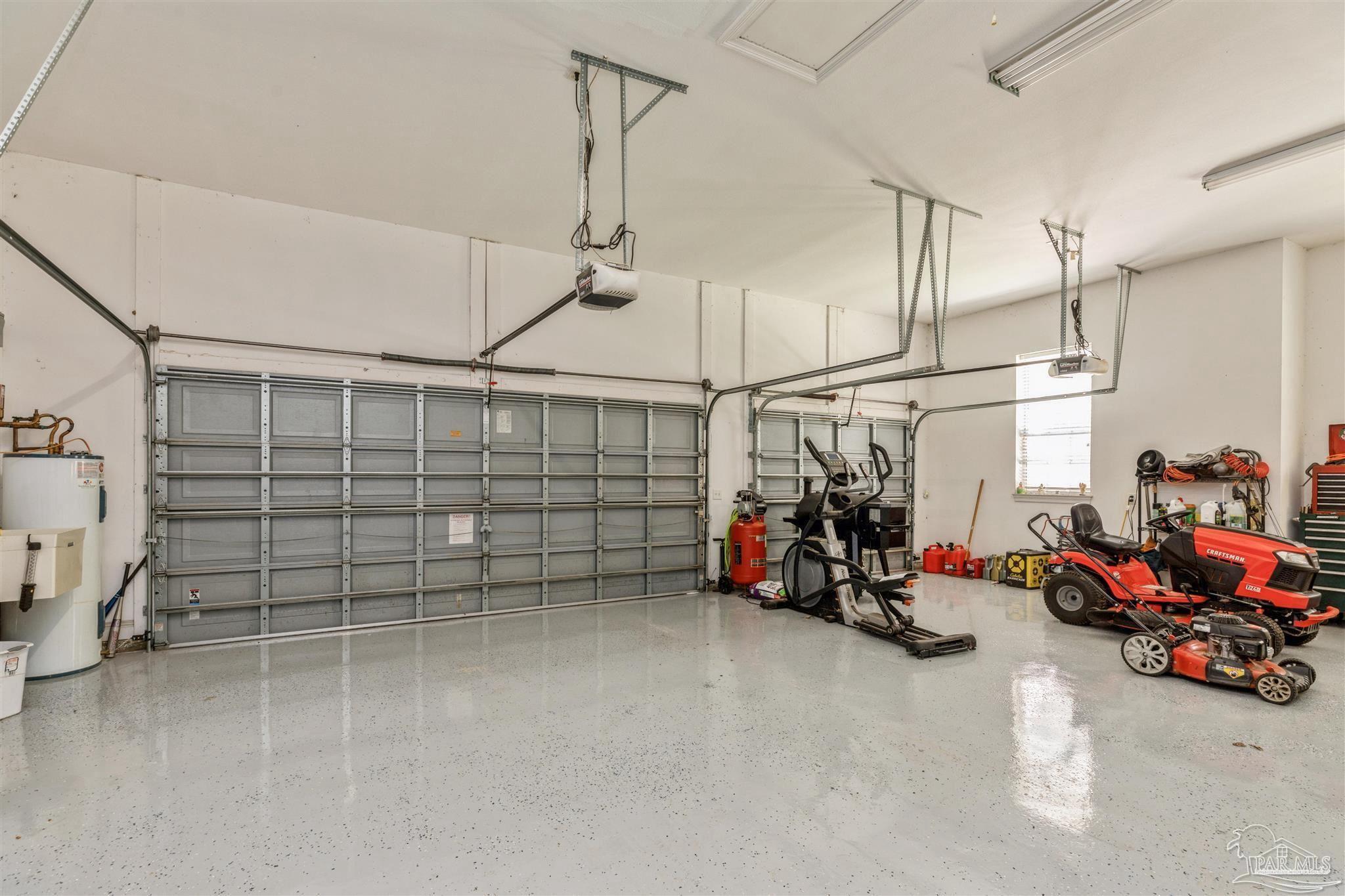 2855 Walling Road Milton, FL 32570 - Photo 38 of 55 a view of a garage with rack and bicycle